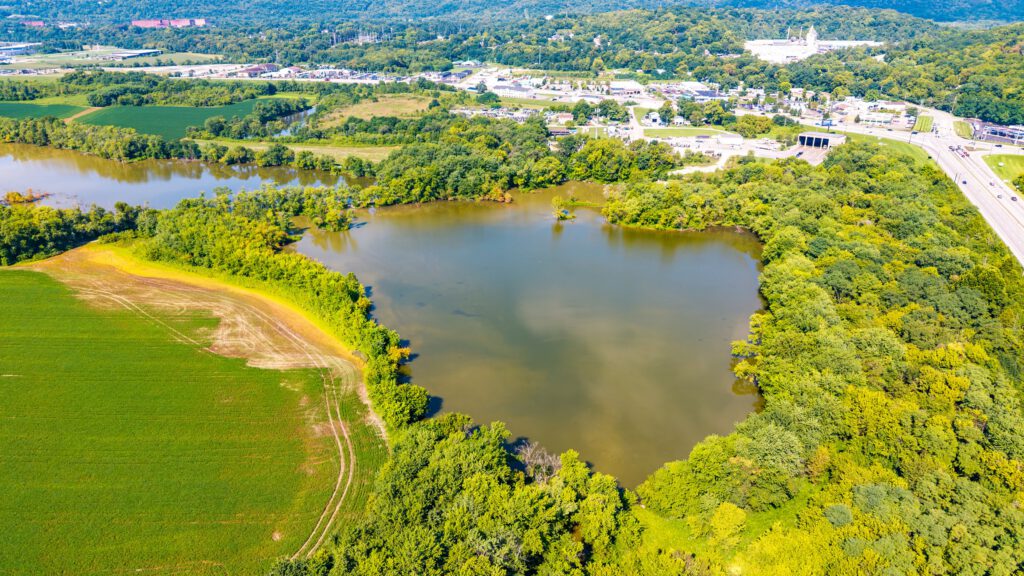 Aerial view of Oxbow Lake surrounded by green floodplain forest